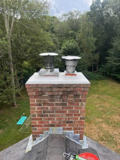 In Colchester, CT, we installed a properly sized stainless steel liner to safely vent acidic exhaust from the high-efficiency oil boiler. The damaged chimney top was also repaired to prevent further structural deterioration. In Colchester, CT, we installed a properly sized stainless steel liner to safely vent acidic exhaust from the high-efficiency oil boiler. The damaged chimney top was also repaired to prevent further structural deterioration.