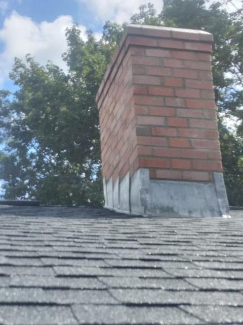 Waterford ct Chimney rebuild from roof up including new lead flashing and new crown.