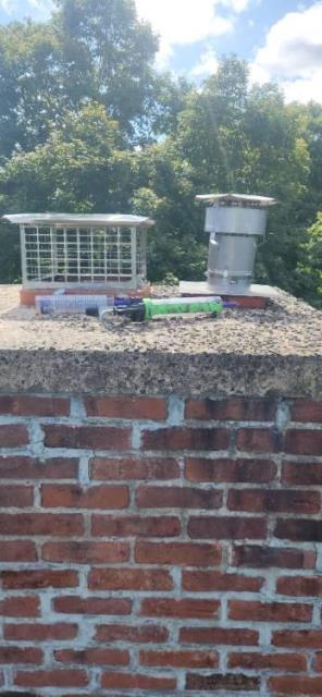In Portland, CT, we installed a stainless steel 2-ply smooth wall liner system to contain acidic exhaust from the high-efficiency oil boiler. This resolved venting issues and helped protect the chimney structure from further deterioration.