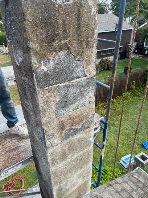 Rebuilt Guilford Ct block chimney with a new stainless steel liner to vent the heating system.