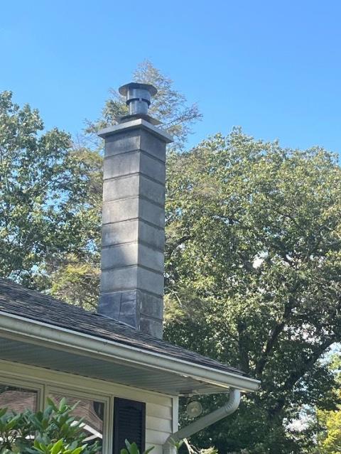 Rebuilt Guilford Ct block chimney with a new stainless steel liner to vent the heating system.
