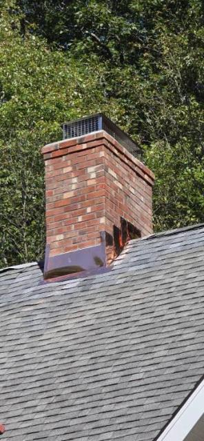 Chimney rebuild Guilford Ct roofline up with a new stainless steel chimney liner.