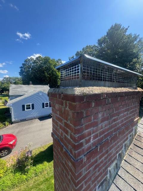 In Enfield, CT, we applied a water repellent to protect the masonry from moisture intrusion and chemical damage. We also replaced the cracked chimney crown to prevent further water penetration and deterioration.