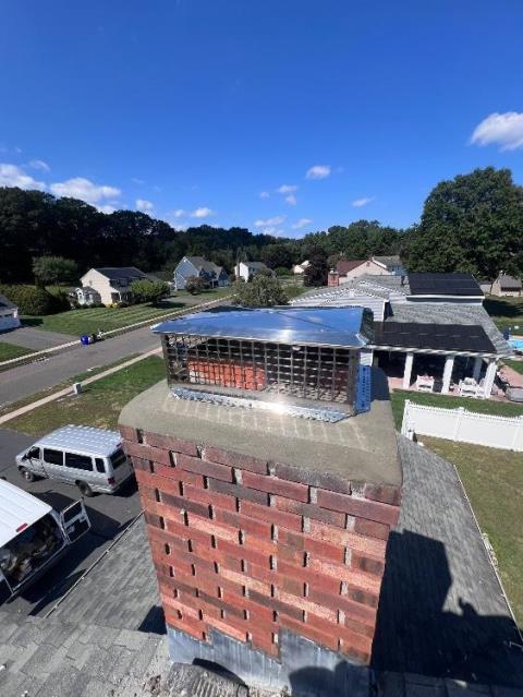 Moss covered crown in Plantsville ct – Removed and replaced cement crown and install a rain cap to protect the chimney from rain and snow.