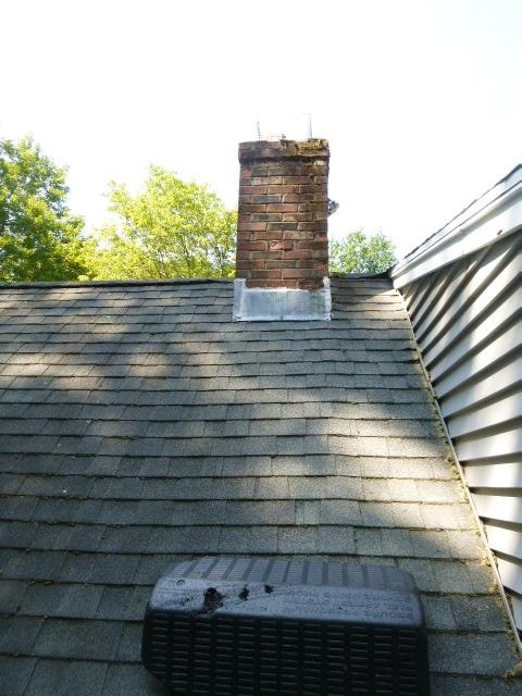 Upgraded chimney flashing with new copper counter flashing to resolve water entry issues.