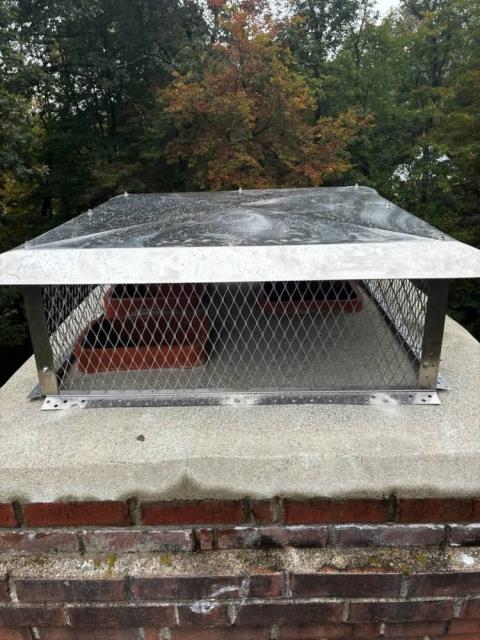 Installation of multi-flue rain cap in Tolland Ct to protect all three flues from new England weather.