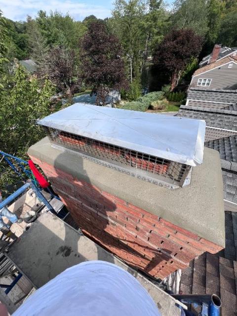 In Greenwich, CT, we removed the top courses of damaged brick and rebuilt the chimney using new severe weather brick. A new cement crown with a drip edge was constructed to improve durability and drainage.