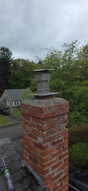 Severely shifted chimney flue tiles in Vernon ct restored with proper venting via a stainless steel flue installation , chimney rebuild recommended in future. 