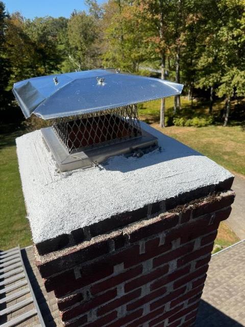 In Greenwich, CT, We repaired both fractured cement crowns with waterproof mortar. A large stainless steel multi-flue cap was installed to prevent water entry.