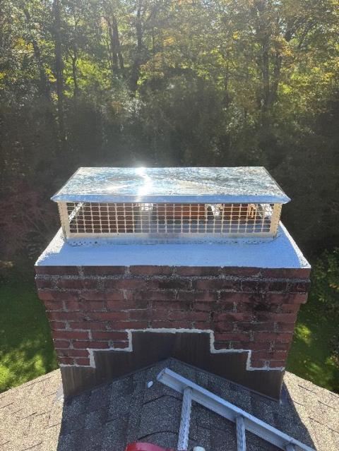 In Greenwich, CT, We repaired both fractured cement crowns with waterproof mortar. A large stainless steel multi-flue cap was installed to prevent water entry.