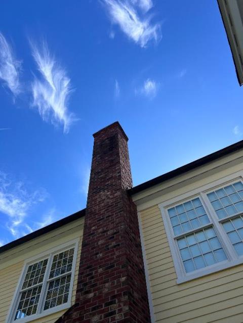 In East Granby, CT, we rebuilt the top ten courses of brick, flue tiles, and crown due to structural damage.
