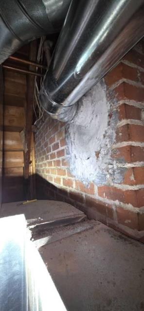 In West Hartford, CT, we installed a stainless steel two-ply smooth wall liner system to properly vent the high-efficiency furnace and water heater. We also removed a bracket from the fireplace glass door for fabrication and later reinstalled both doors with the new part.