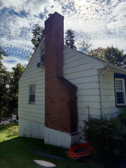 In Ellington, CT, we installed a stainless steel liner system to safely vent acidic exhaust from the high-efficiency oil boiler. This addressed internal chimney deterioration and helped protect the remaining masonry structure.