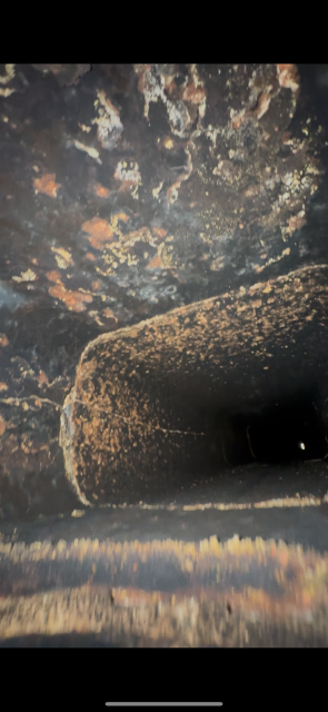 In Suffield, CT, we replaced the deteriorated chimney crown and installed a new stainless steel liner system to restore safe venting. These repairs addressed severe condensation damage and structural degradation within the flue.