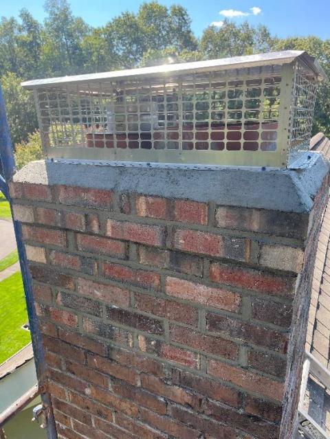 In Unionville, CT, we installed a stainless steel insulated liner to properly vent the high-efficiency oil boiler. We then rebuilt the top portion of the chimney and flue system to correct structural damage.