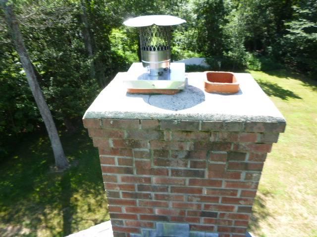 In Colchester, CT, We installed a stainless steel two-ply smooth wall liner to ensure safe venting and protect the chimney structure. We repaired the chimney crown, repointed open joints, and installed a stainless steel cap to prevent future deterioration.