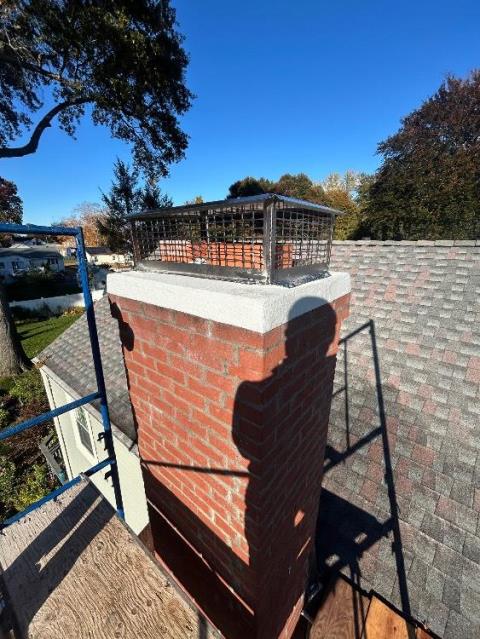 In Wethersfield, CT, We repaired the chimney crown with a flexible membrane and installed new lead flashing for lasting protection. A stainless steel multi-flue cap and water repellent were also applied for durability and weather resistance.