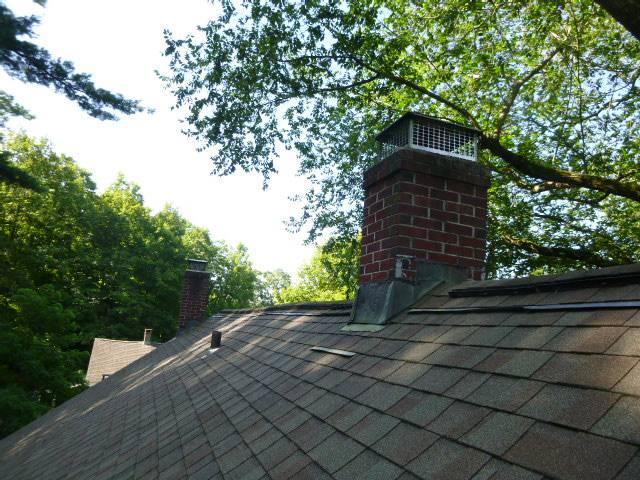 In Collinsville, CT, we removed deteriorated flashing on both chimneys and installed new counter flashing, properly sealed and embedded into the brickwork. This prevented further water intrusion and protected the surrounding structure.