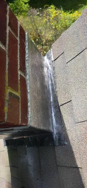 In Collinsville, CT, we removed deteriorated flashing on both chimneys and installed new counter flashing, properly sealed and embedded into the brickwork. This prevented further water intrusion and protected the surrounding structure.