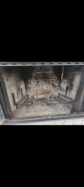 In Greenwich CT, We removed the damaged refractory panels from the metal fireplace and installed four new high-temperature panels. This restoration ensured safe heat and smoke containment within the wooden chase structure.