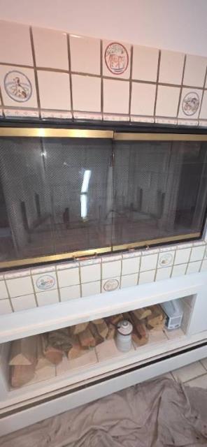 In Greenwich CT, We removed the damaged refractory panels from the metal fireplace and installed four new high-temperature panels. This restoration ensured safe heat and smoke containment within the wooden chase structure.