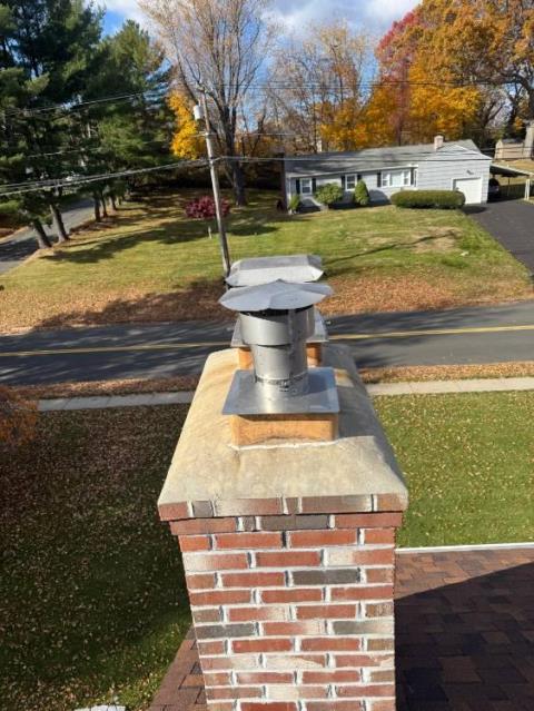 In Cromwell CT, we installed a UL Listed stainless steel chimney liner system to replace the damaged interior flue. This restored safe, efficient venting and protected the chimney from future condensate damage.