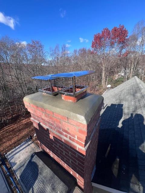 Deep River Ct Masonry Repair.  Rebuilt the top damaged crown and deteriorated upper brick courses. Installed new stainless steel rain/snow caps to protect the chimney flues.
