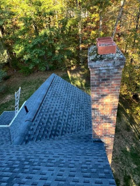 In Glastonbury, CT, we remortared the fractured chimney crown with waterproof cement to stop water entry and protect the masonry structure. We installed two stainless steel caps to seal and safeguard both venting systems from weather and animals.