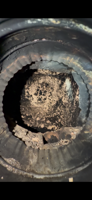 In Tolland CT We installed a stainless steel liner system to correct the failed flue and safely vent the oil burner. This restoration protected the chimney structure from ongoing acidic moisture damage.
