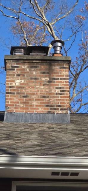 In Tolland CT We installed a stainless steel liner system to correct the failed flue and safely vent the oil burner. This restoration protected the chimney structure from ongoing acidic moisture damage.
