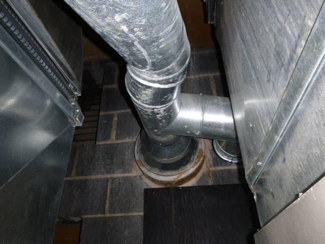 In Norwalk CT we found severe condensation damage and failing flue tiles causing obstruction. We installed a properly sized stainless steel liner and cap for safe venting.