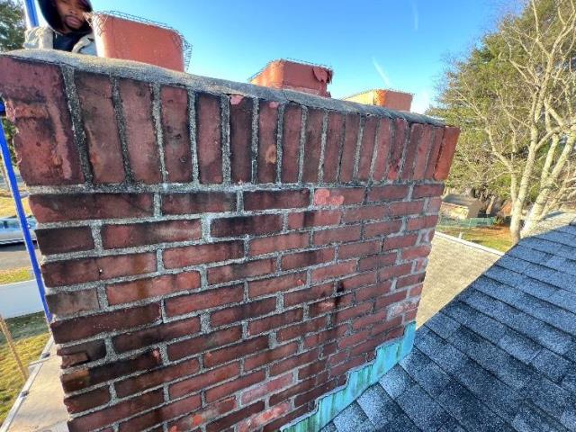 In East hartford CT We rebuilt the damaged top courses of the chimney to restore structural integrity. We installed new flue tiles, brickwork, crown, and protective cap.