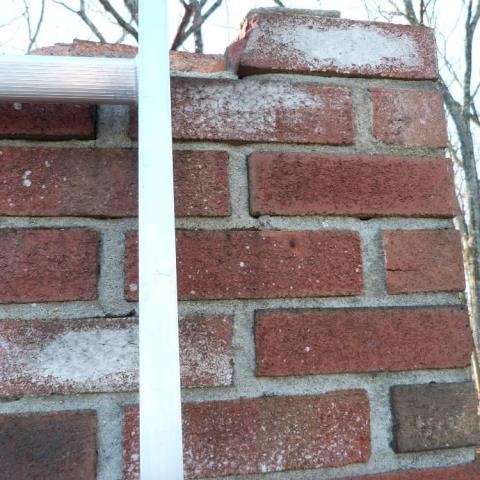 In Avon CT We found a thin, failing crown with minor mortar deterioration on one chimney side , with the top course of brick in poor shape. We removed the crown , reset brick and constructed a new cement crown wash with a stainless termination cap.
