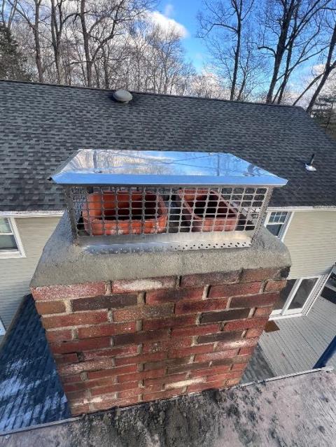In Avon CT We found a thin, failing crown with minor mortar deterioration on one chimney side , with the top course of brick in poor shape. We removed the crown , reset brick and constructed a new cement crown wash with a stainless termination cap.
