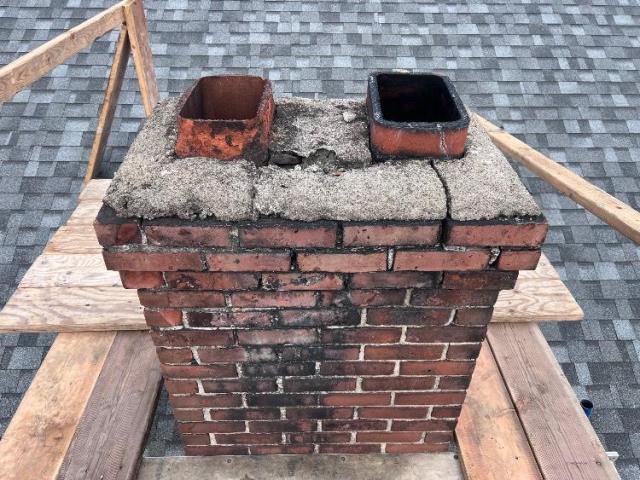 In Hartford CT We found sulfuric acid damage causing loose brick and leaks. We rebuilt the chimney top with brick, crown, and cap.