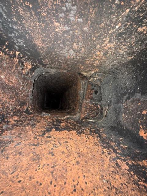 We installed a properly sized stainless steel chimney liner for the high-efficiency oil boiler. This corrected condensation damage and restored safe venting in the deteriorated chimney flue.