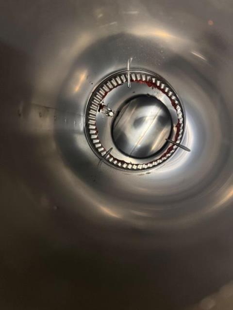 We installed a properly sized stainless steel chimney liner for the high-efficiency oil boiler. This corrected condensation damage and restored safe venting in the deteriorated chimney flue.