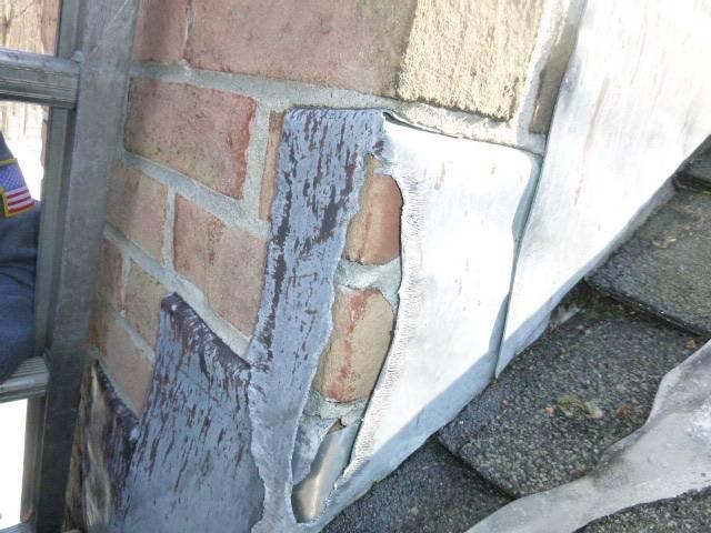 We installed a stainless steel liner to safely vent the oil boiler and protect the masonry structure. We repaired the cement crown, repointed mortar joints, and replaced damaged flashing to prevent water entry.