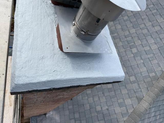 We installed a stainless steel liner to safely vent the oil boiler and protect the masonry structure. We repaired the cement crown, repointed mortar joints, and replaced damaged flashing to prevent water entry.