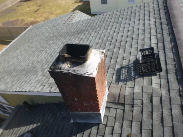 We inspected a Newington, CT chimney, that was missing its chimney cap. We found the tiles to be water damaged, with oil soot leaching in between the tiles and brick through gaps.  Soultion was to install a gas tight flue system with a proper rain cap.