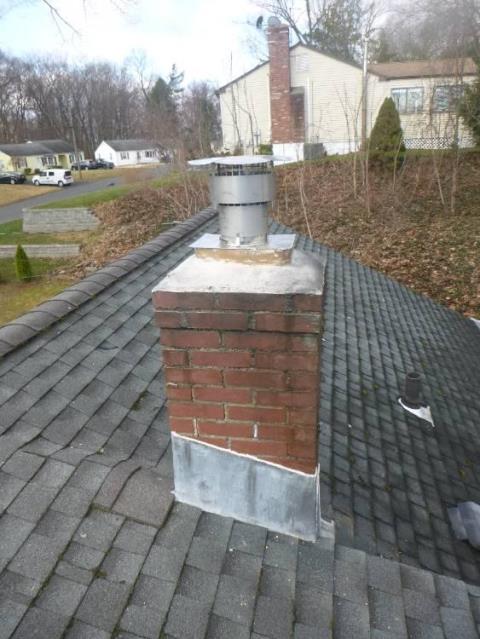 We inspected a Newington, CT chimney, that was missing its chimney cap. We found the tiles to be water damaged, with oil soot leaching in between the tiles and brick through gaps.  Soultion was to install a gas tight flue system with a proper rain cap.