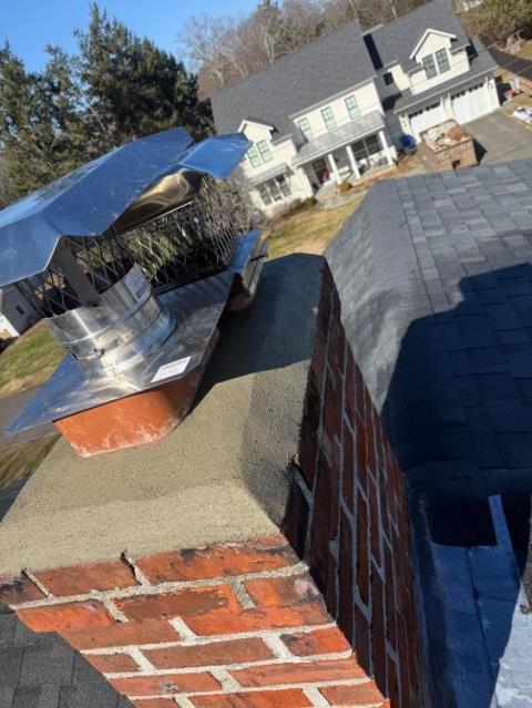 We installed a properly sized stainless steel liner to correct venting issues and protect the chimney structure. We rebuilt the crown, repointed mortar joints, and installed new caps to improve draft and prevent water damage.