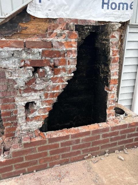 Chimney rebuild in New Britain CT down to the foundation after uncovering severe saturation and structural damage. The project included new brick, flue tiles, flashing, and a cement crown - restoring structural integrity, venting safety, and long-term protection for the home.