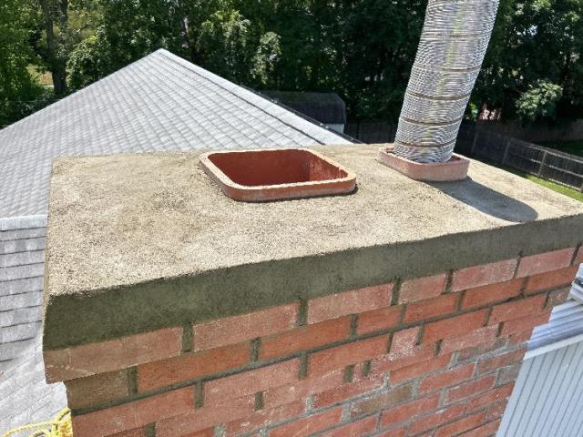 Chimney rebuild in New Britain CT down to the foundation after uncovering severe saturation and structural damage. The project included new brick, flue tiles, flashing, and a cement crown - restoring structural integrity, venting safety, and long-term protection for the home.