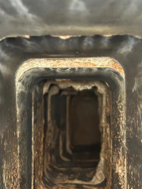 The existing flue had offset clay tiles and interior deterioration, creating an uneven path for exhaust gases.We installed a continuous stainless steel liner to provide a smooth, properly sized venting system and restore reliable draft.