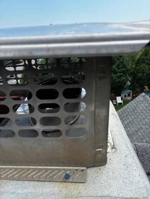 In Middletown, CT, the exhaust from two gas boilers and two water heaters is resulting in sulfuric acid damage to the flue. This is leading to poor draft, appliance issues, and structural deterioration, requiring a properly sized stainless steel liner for safe, efficient venting.