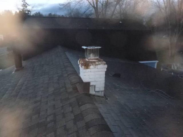 We rebuilt the chimney from the roofline up including installation of a precast chimney crown, correcting severe acid damage and structural deterioration. We insulated the liner to reduce condensation and protect the masonry system.