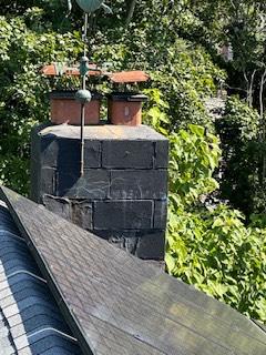 Safeside Chimney rebuilt the damaged chimney and installed a properly vented gas insert system. We replaced deteriorated block masonry, flue components, flashing, and crown, then completed a full cleanup.