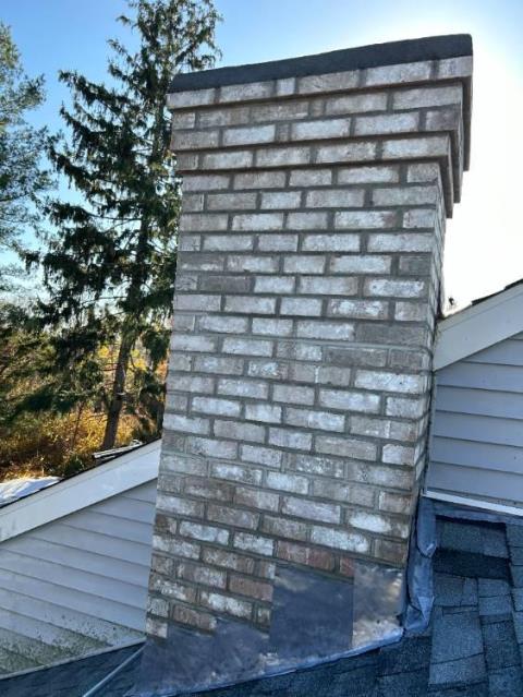 Safeside Chimney rebuilt the damaged chimney and installed a properly vented gas insert system. We replaced deteriorated block masonry, flue components, flashing, and crown, then completed a full cleanup.