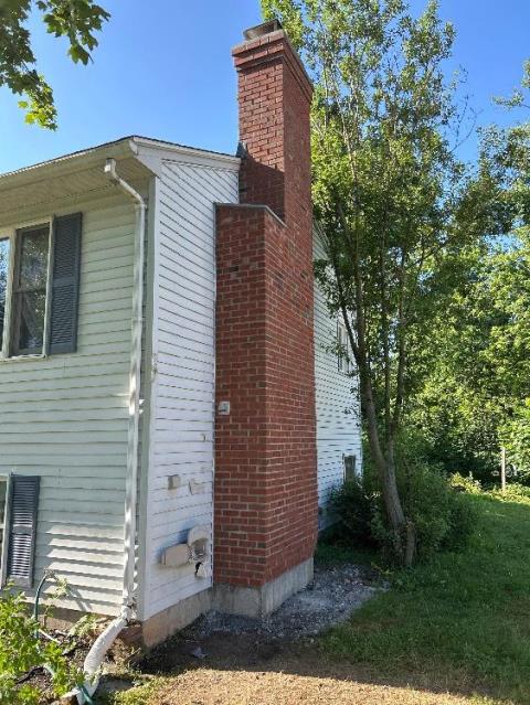 We rebuilt the entire chimney structure, smoke chamber, and flue system to meet current code requirements. We removed obstructions, installed new flashing and bluestone components, and hauled away all debris.